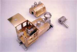 0-6-0 side tank with rear entry cab and woodburner stack. Also shown are some of the available options, namely the saddle tank and taper stack. These may be specified instead of the parts on the loco.
